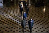 Clerk of the House Cheryl Johnson along with acting House Sergeant-at-Arms Tim Blodgett, right, and Rep. Jamie Raskin, D-Md., lead the Democratic House impeachment managers as they walk through Statuary Hall on Capitol Hill to deliver to the Senate the article of impeachment alleging incitement of insurrection against former President Donald Trump, in Washington, Monday, Jan. 25, 2021. (Tasos Katopodis/Pool Photo via AP)