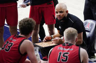 Eastern Washington head coach Shantay Legans talks to his players during the second half of an NCAA college basketball game against Arizona, Saturday, Dec. 5, 2020, in Tucson, Ariz. (AP Photo/Rick Scuteri)