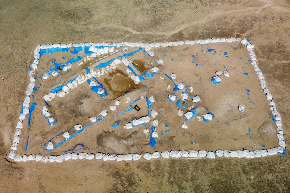 An aerial picture shows a general view of the newly-excavated trench which may have contained an inn with a cooling area for food storage, at the site of the ancient city-state of Lagash, in Iraq's al-Shatra district of the southern Dhi Qar province on February 11, 2023.  / Credit: ASAAD NIAZI/AFP via Getty Images