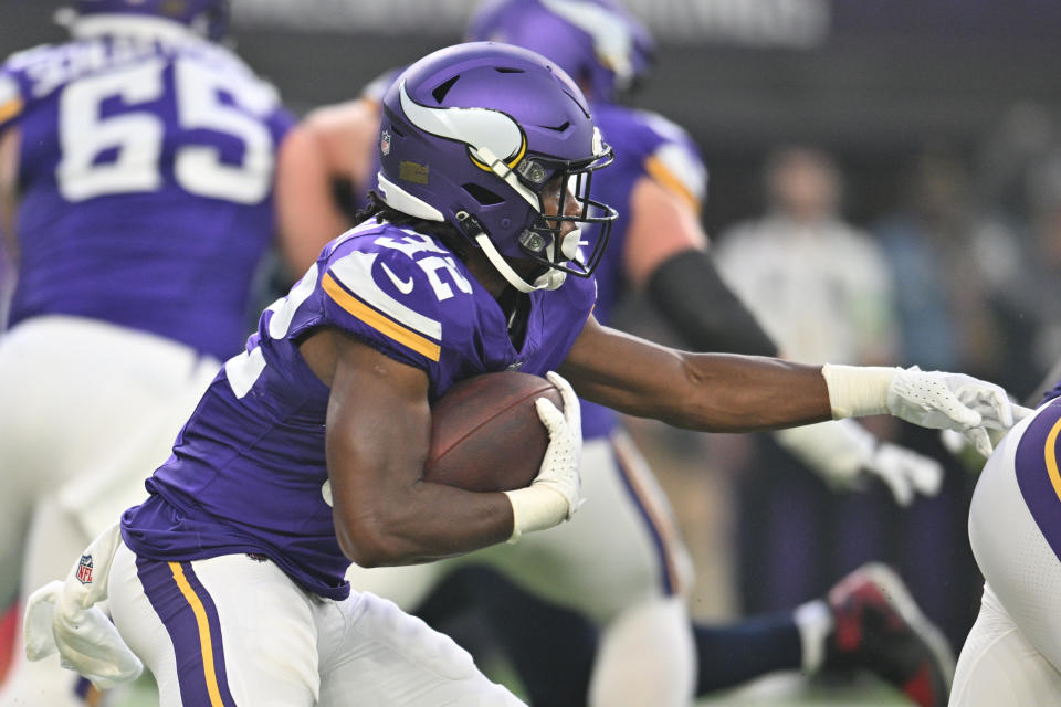 Aug 19, 2023; Minneapolis, Minnesota, USA; Minnesota Vikings running back <a class="link " href="https://sports.yahoo.com/nfl/players/34125" data-i13n="sec:content-canvas;subsec:anchor_text;elm:context_link" data-ylk="slk:Ty Chandler;sec:content-canvas;subsec:anchor_text;elm:context_link;itc:0">Ty Chandler</a> (32) runs the ball against the Tennessee Titans during the first quarter at U.S. Bank Stadium. Mandatory Credit: Jeffrey Becker-USA TODAY Sports