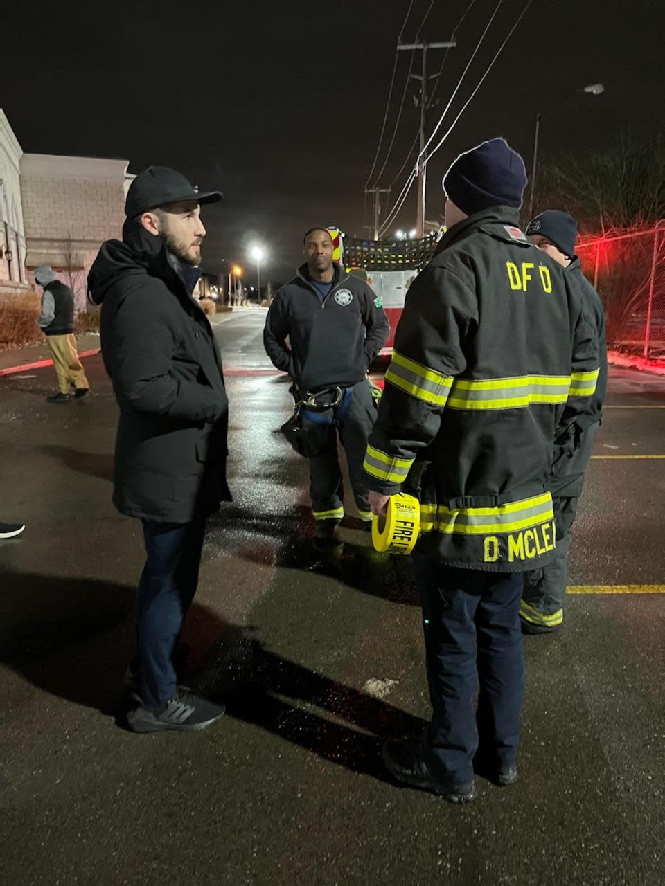 Dearborn Mayor Abdullah Hammoud speaks with Dearborn firefighters after a fire at Al-Huda Islamic Association, a mosque on Warren Avenue. Photo taken at 2:33 am. Dearborn Police said their officers fatally shot a man in Detroit they had encountered near the mosque after he fired at officers.