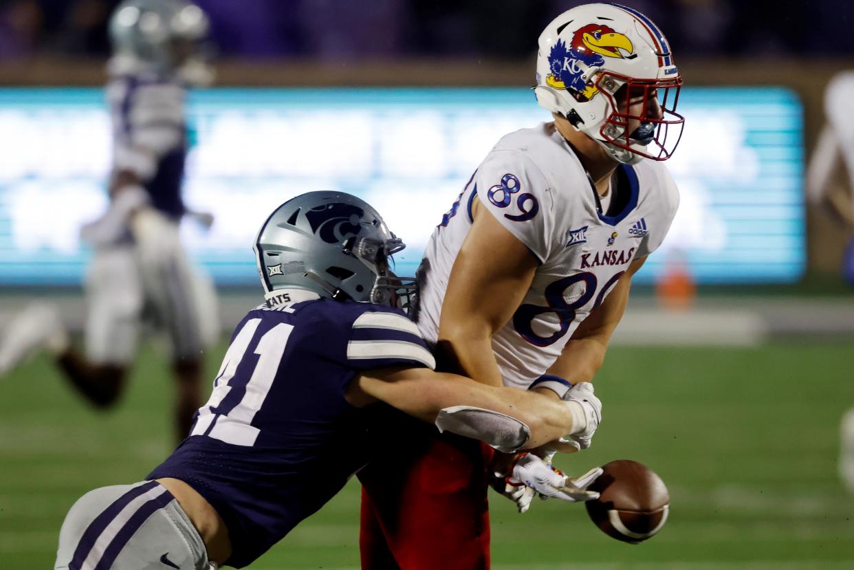 Kansas State linebacker Austin Moore (41) defends against Kansas tight end Mason Fairchild (89) during last year's Sunflower Showdown in Manhattan.