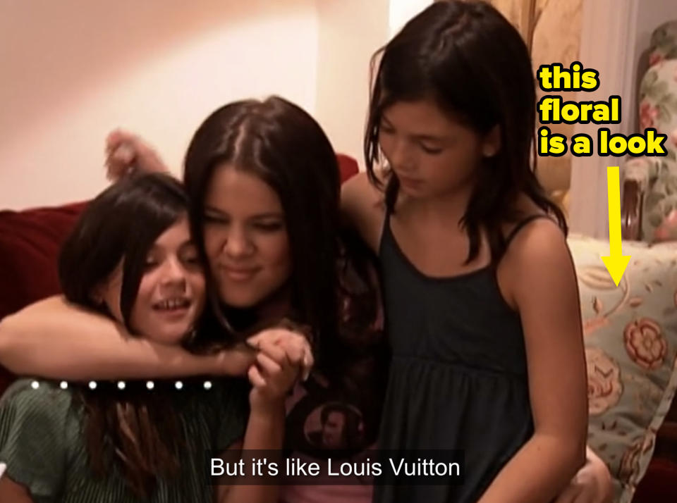 Khloe hugging young Kylie and Kendall