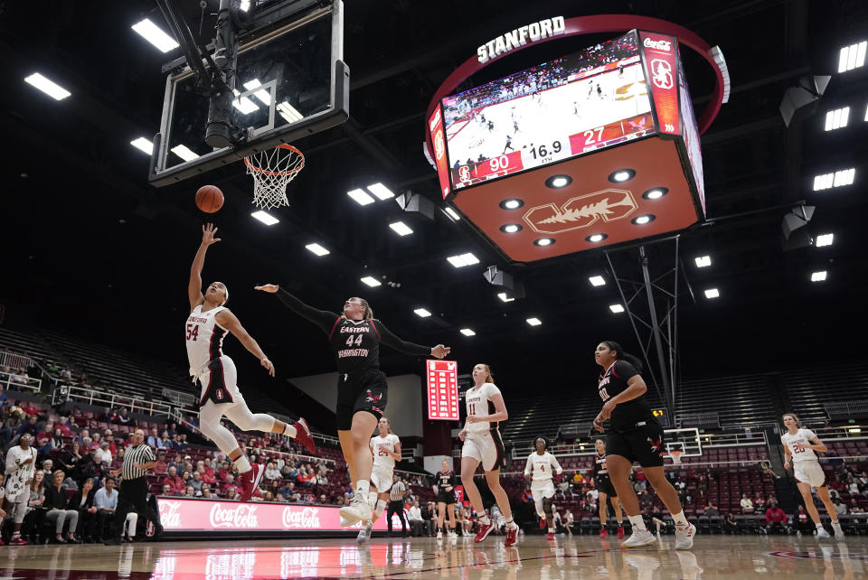 Stanford guard Jenna Brown (54) lays the ball up as Eastern Washington center Leya DePriest (44) defends during the second half of an NCAA college basketball game Tuesday, Nov. 5, 2019, in Stanford, Calif. Stanford won 92-27. (AP Photo/Tony Avelar)