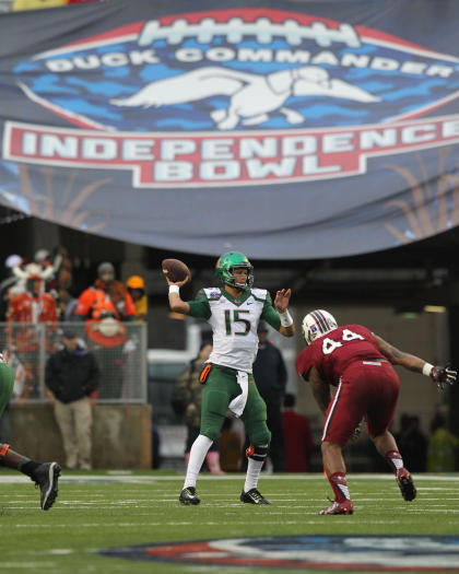 Dec 27, 2014; Shreveport, LA, USA; Miami Hurricanes quarterback Brad Kaaya (15) looks to pass as South Carolina Gamecocks defensive end Gerald Dixon (44) pressures during the first half in the 2014 Independence Bowl at Independence Stadium. (Nelson Chenault-USA TODAY Sports)