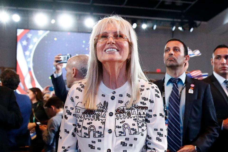 Miriam Adelson listens as Trump addresses an Israeli American Council summit in Hollywood in 2019 (Associated Press)