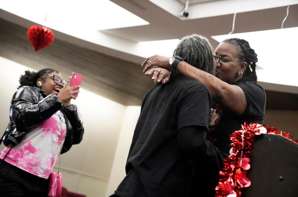 Dai White, 17, reacts as her parents Dia and Donny Jackson of Whitehall are married in the Franklin County Municipal Court on Valentine's Day.