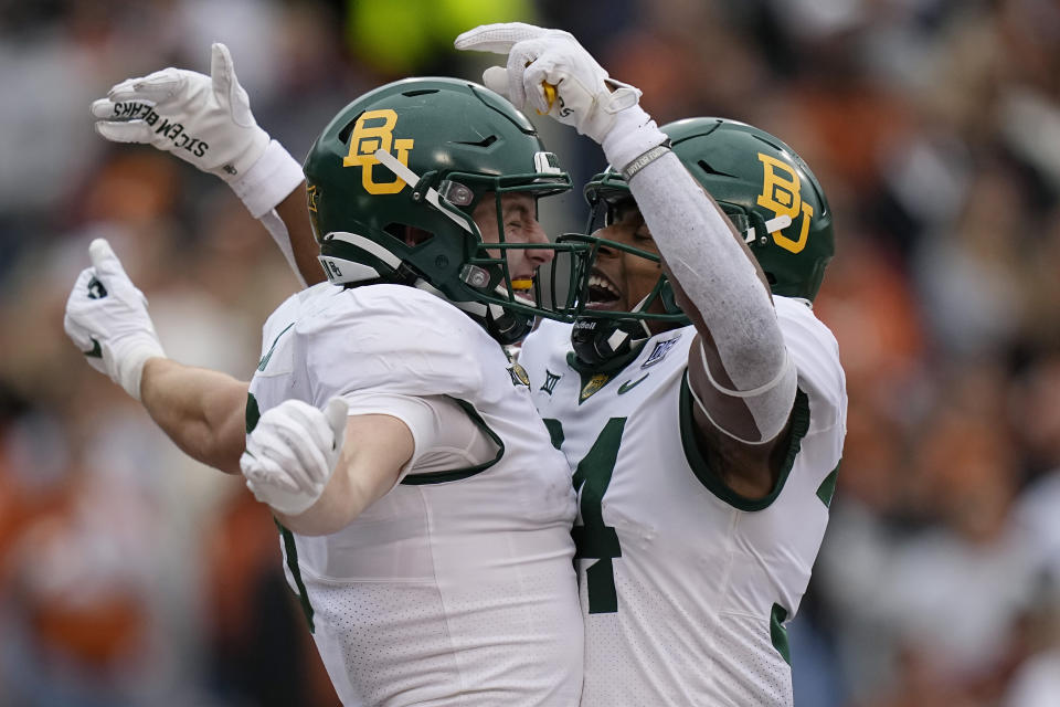 Baylor tight end Ben Sims, left, celebrates with teammate Josh Cameron, right, after he scored a touchdown against Texas during the first half of an NCAA college football game in Austin, Texas, Friday, Nov. 25, 2022. (AP Photo/Eric Gay)