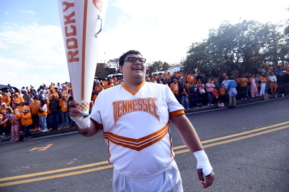 A Tennessee cheerleader gets the crowd excited during the Vol Walk ahead of the NCAA college football game between Tennessee and Georgia on Saturday, November 18, 2023 in Knoxville, Tenn.