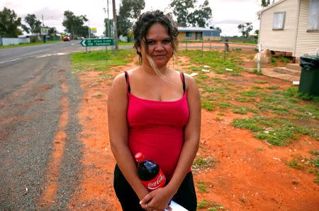 Tara Kelly, from a local Aboriginal community, stands near a remote voting station after she voted in the western New South Wales outback town of Enngonia, Australia, June 22, 2016. REUTERS/David Gray