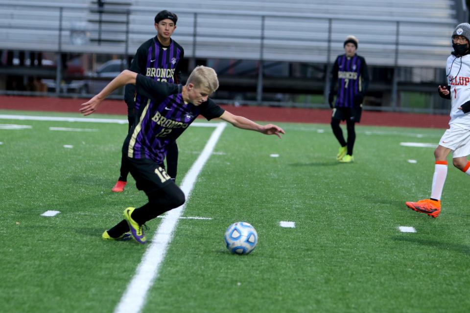 Kirtland Central's Easton Warner controls a pass and prepares to head down the field during a boys soccer match against Gallup, Tuesday, Oct. 12, 2021 at Bill Cawood Field.