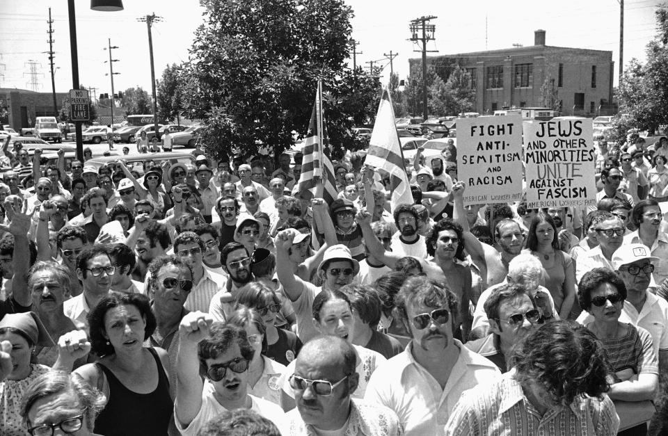 A large group of anti-Nazi demonstrators chant at a park in the predominantly Jewish Chicago suburb of Skokie, Ill., on July 4, 1977, protesting a possible march in Skokie by Nazis. (Photo: Charles Knoblock/AP)