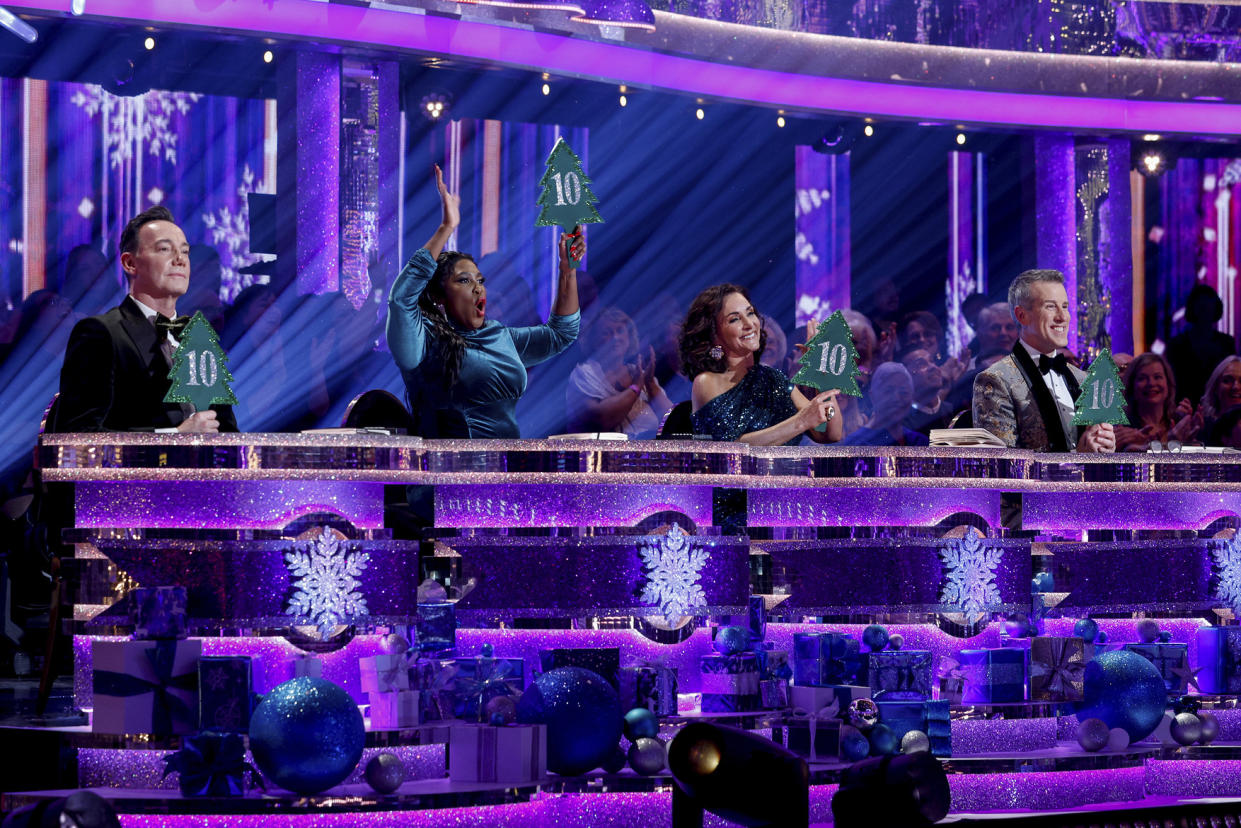 Craig Revel Horwood, Motsi Mabuse, Shirley Ballas and Anton Du Beke display their festive score paddles, but will any of the celebrities earn a perfect 40 on the 2023 Strictly Come Dancing Christmas special? (BBC)