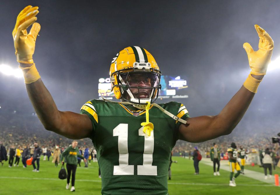 Green Bay Packers wide receiver Jayden Reed (11) celebrates a victory over the Chicago Bears during their football game at Lambeau Field.