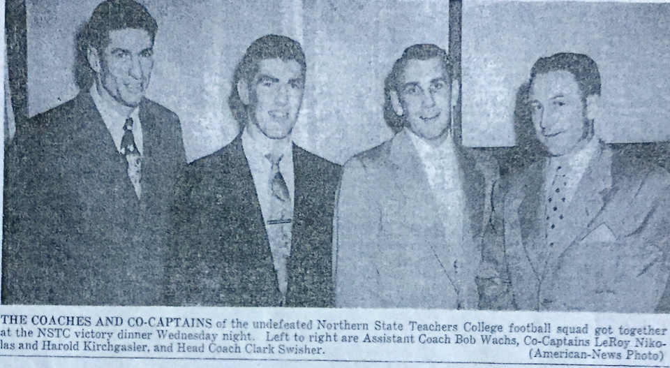 Coaches and co-captains from the 1953 undefeated team. From left are assistant coach Bob Wachs, LeRoy Nikolas, Harold Kirchgasler and head coach Clark Swisher.