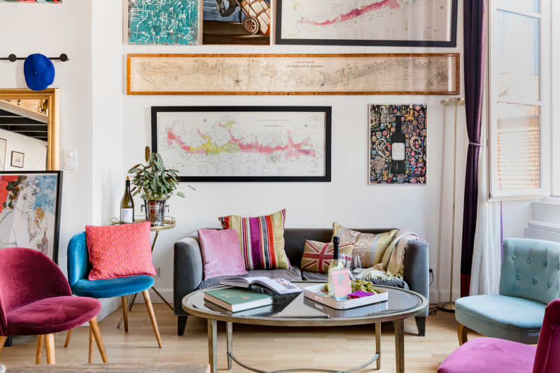 Colorful chairs below-framed wall art.