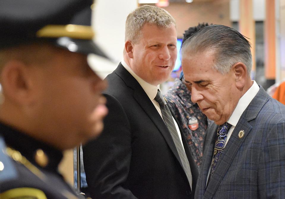 Bristol County Sheriff Paul Heroux greets state rep. Alan Silvia Tuesday, Jan. 3 at B.M.C. Durfee High School in Fall River.