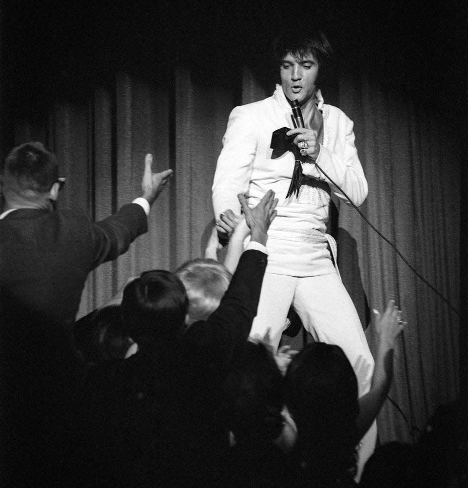 Elvis Presley performs on stage in 1969.