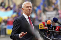 Latvia's Prime Minister Krisjanis Karins speaks with the media as he arrives for an EU Summit at Prague Castle in Prague, Czech Republic, Friday, Oct 7, 2022. European Union leaders converged on Prague Castle Friday to try to bridge significant differences over a natural gas price cap as winter approaches and Russia's war on Ukraine fuels a major energy crisis. (AP Photo/Darko Bandic)