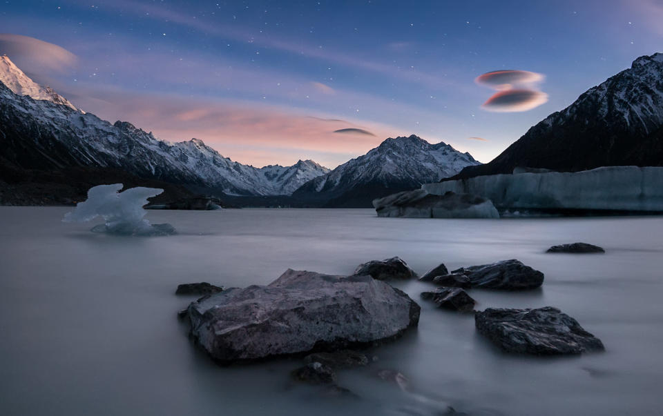 Tasman Glacier Lake in Mount Cook National Park Sunrise View with lenticular clouds.