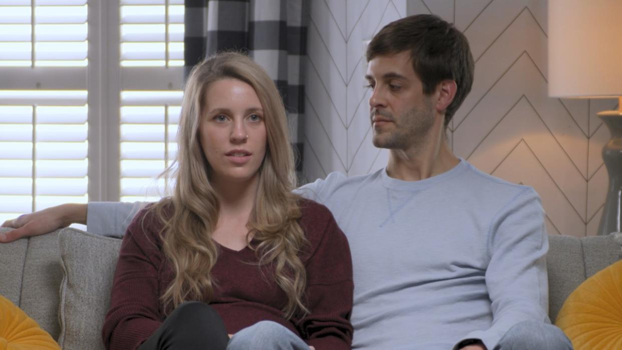  Jill and Derick Dillard on couch in Shiny Happy People: Duggar Family Secrets 