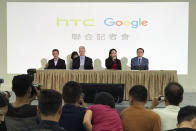 <p>Cher Wang, chairperson of HTC, second from right, speaks during a press conference in New Taipei City, Taiwan, Thursday, Sept. 21, 2017. Google is biting off a big piece of device manufacturer HTC for $1.1 billion to expand its efforts to build phones, speakers and other gadgets equipped with its arsenal of digital services. With Wang is, from left, Mario Queiroz, vice president of product management at Google, Rick Osterloh, senior vice president of hardware for Google, and Chia-Lin Chang, president of smartphones and connected devices for HTC. (AP Photo/Johnson Lai) </p>