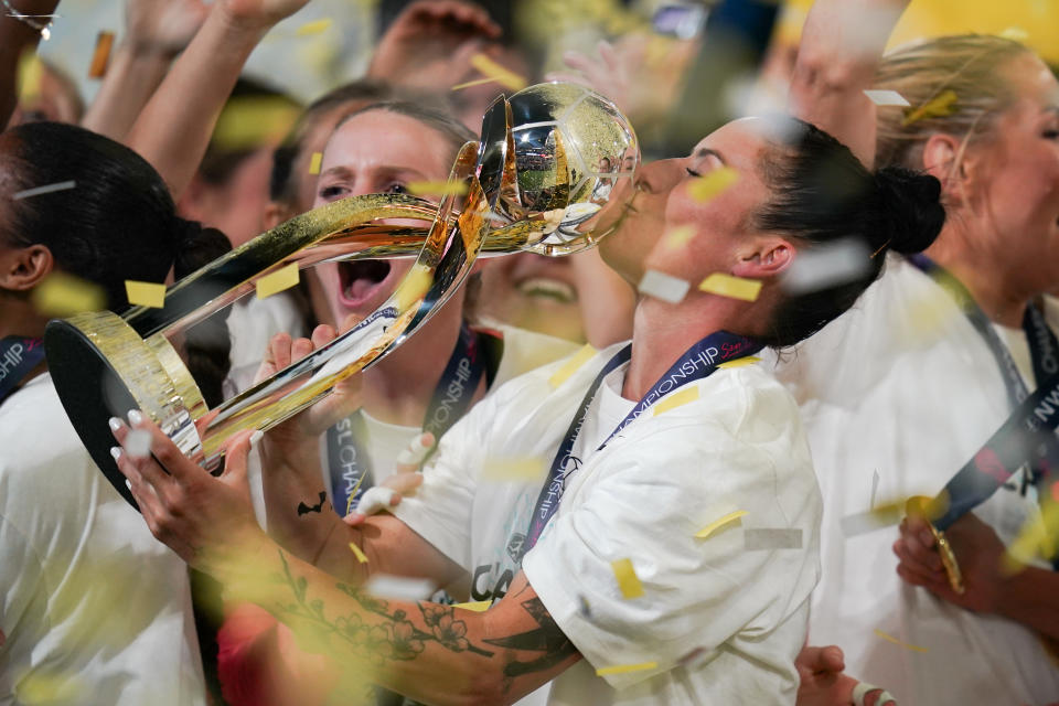 SAN DIEGO, CALIFORNIA - NOVEMBER 11: Ali Krieger #11 of NJ/NY Gotham FC kisses the NWSL trophy at Snapdragon Stadium on November 11, 2023 in San Diego, California. (Photo by Ben Nichols/ISI Photos/Getty Images)