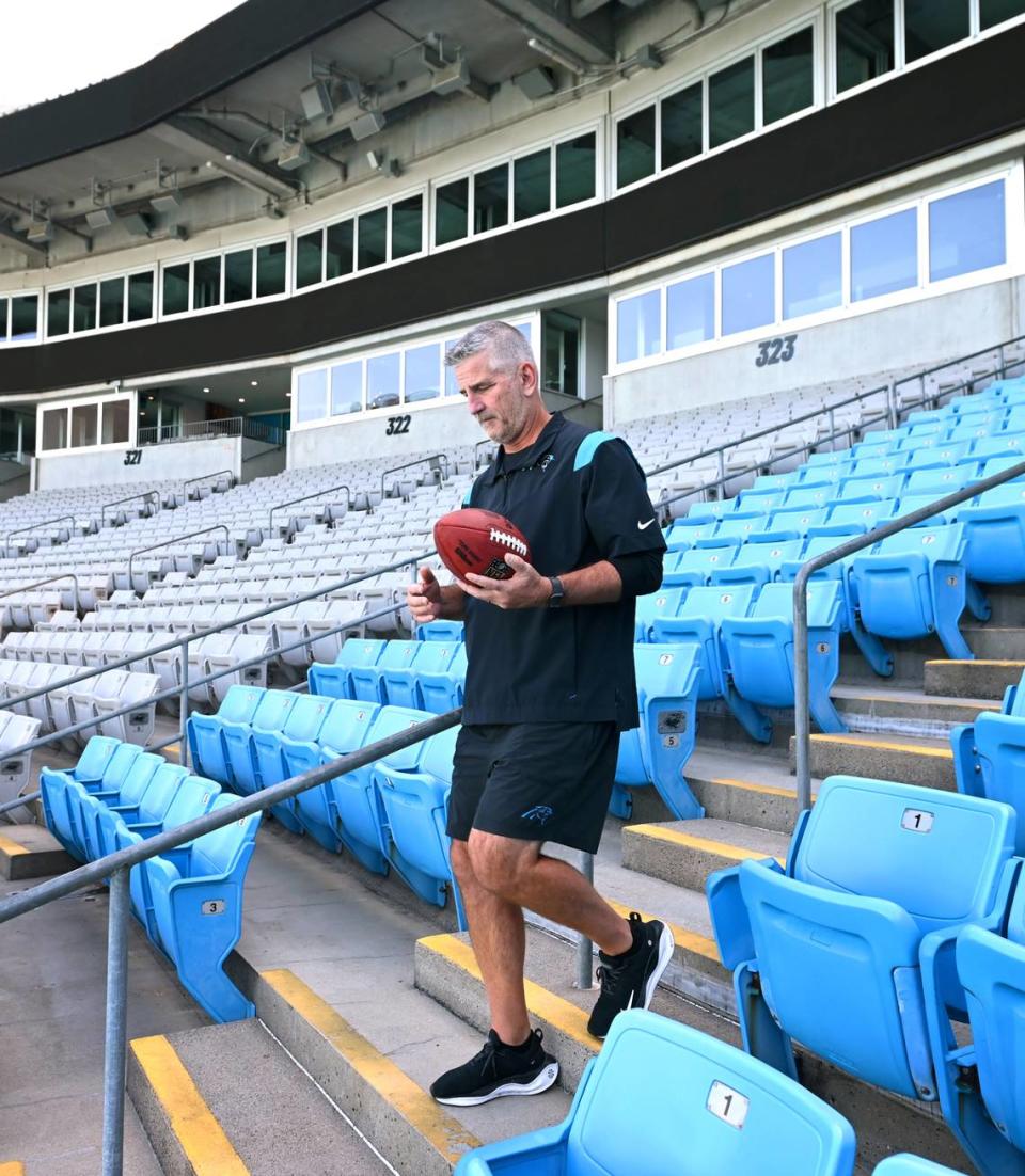 New Carolina Panthers head coach Frank Reich, walking through the stands at Bank of America Stadium in August 2023, makes his debut for the team in a road game against Atlanta Sept. 10th. In another game at Atlanta, in 1995, Reich led the Panthers in their first-ever game -- but that time as the team’s quarterback. It was one of only 3 games he would start for Carolina.