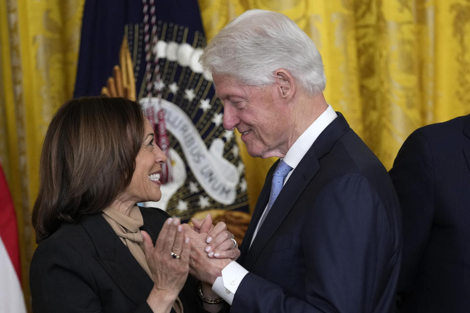 Vice President Kamala Harris and former President Bill Clinton talk during and event with President Joe Biden in the East Room of the White House in Washington, Thursday, Feb. 2, 2023, to mark the 30thAnniversary of the Family and Medical Leave Act. (AP Photo/Susan Walsh)