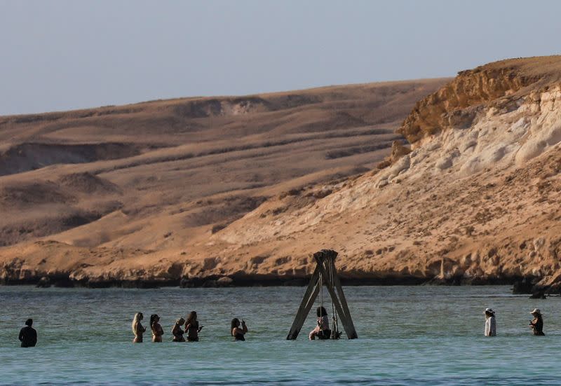 Tourists enjoy a day by the beach during their summer vacation at a Red Sea resort, amid the coronavirus disease (COVID-19) outbreak, in Hurghada