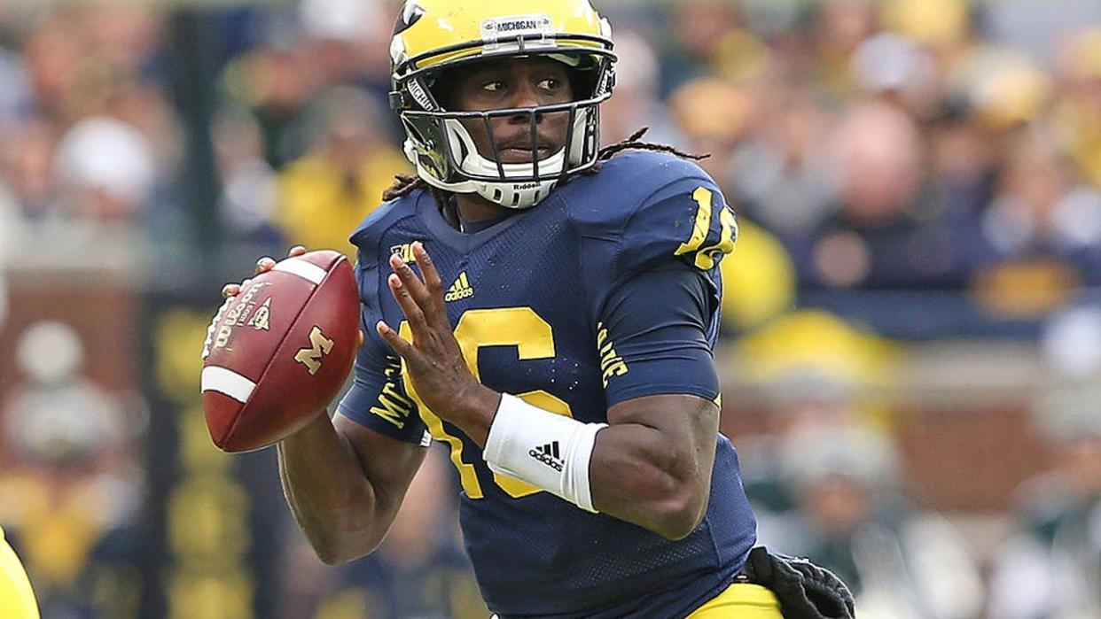 <div>ANN ARBOR, MI - OCTOBER 20: Denard Robinson #16 of the Michigan Wolverines drops back to pass during the game against the Michigan State Spartans at Michigan Stadium on October 20, 2012 in Ann Arbor, Michigan. The Wolverines defeated the Spartans 12-10. (Photo by Leon Halip/Getty Images)</div>