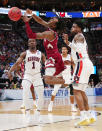 <p>Terrell Brown #3 of the New Mexico State Aggies battles for the ball against Jared Harper #1 and Malik Dunbar #4 of the Auburn Tigers during the first half in the first round of the 2019 NCAA Men’s Basketball Tournament at Vivint Smart Home Arena on March 21, 2019 in Salt Lake City, Utah. (Photo by Tom Pennington/Getty Images) </p>