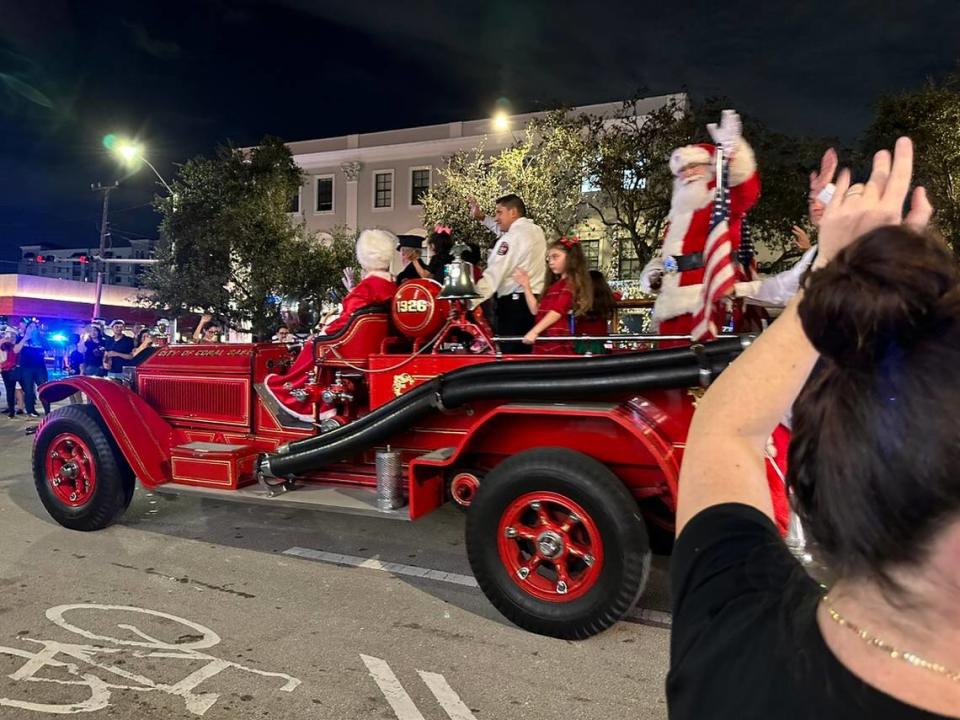Santa Claus closes the 75th Annual Junior Orange Bowl Parade with waves to and from the crowd lining Miracle Miles in Coral Gables on Dec. 10, 2023.
