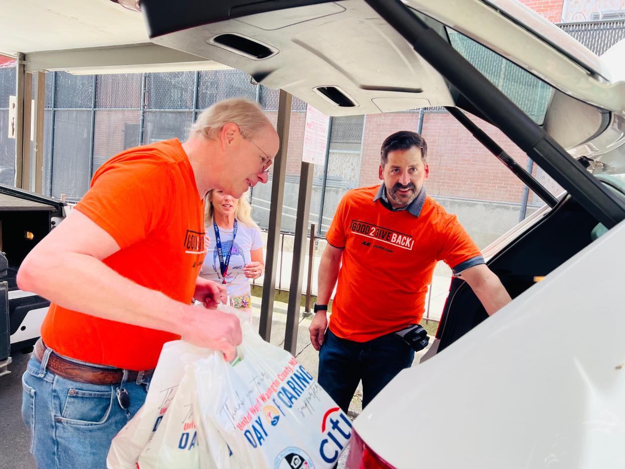 JLG Industries volunteers load hygiene products for delivery to a local school. JLG's Good 2 Give Back volunteer program helped United Way of Washington County with its "hygiene closet" project during National Volunteer Week.