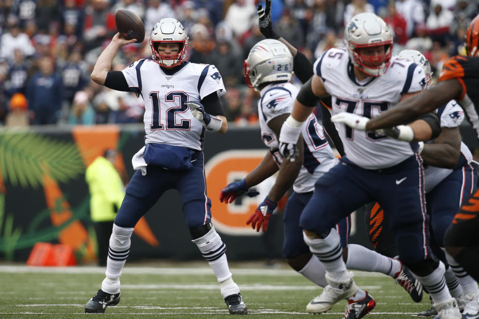 File-This Dec. 15, 2019, file photo shows New England Patriots quarterback Tom Brady (12) passing in the second half of an NFL football game against the Cincinnati Bengals, in Cincinnati. Members of a special panel of 26 selected all of them for the position as part of the NFL's celebration of its 100th season. All won league titles except Marino. All are in the Hall of Fame except Brady and Manning, who are not yet eligible. On Friday, Dec. 27, 2019, quarterback was the final position revealed for the All-Time Team. (AP Photo/Frank Victores, File)