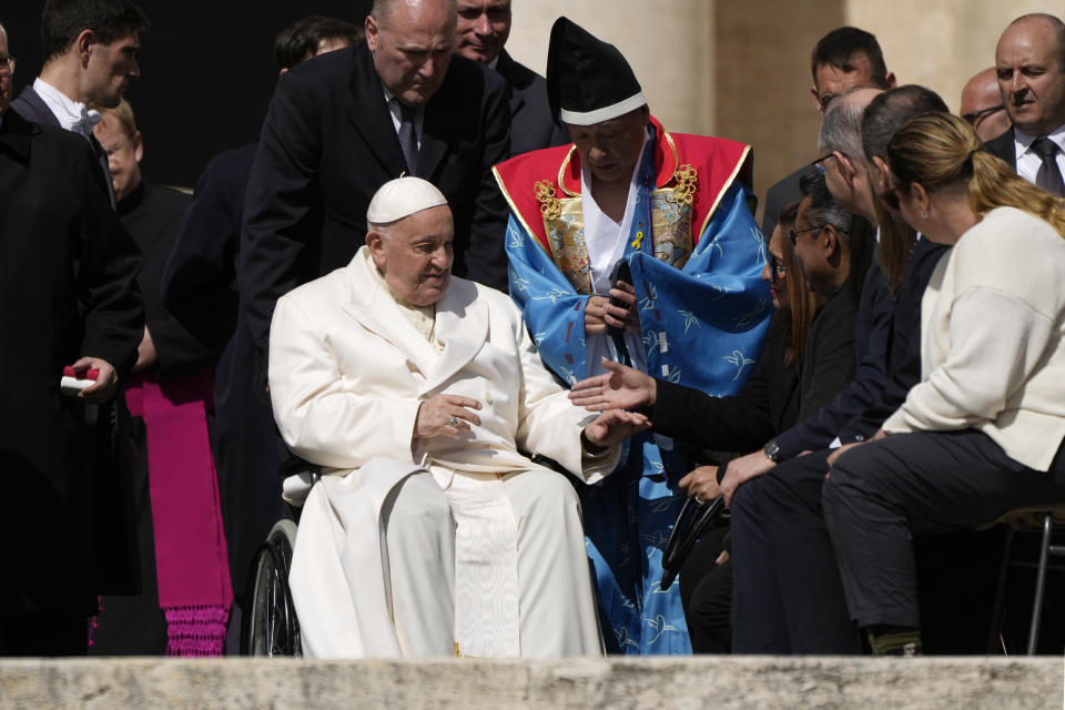 Pope Francis meets faithful at the end of his weekly general audience in St. Peter's Square, at the Vatican, Wednesday, April 24, 2024. (AP Photo/Alessandra Tarantino)