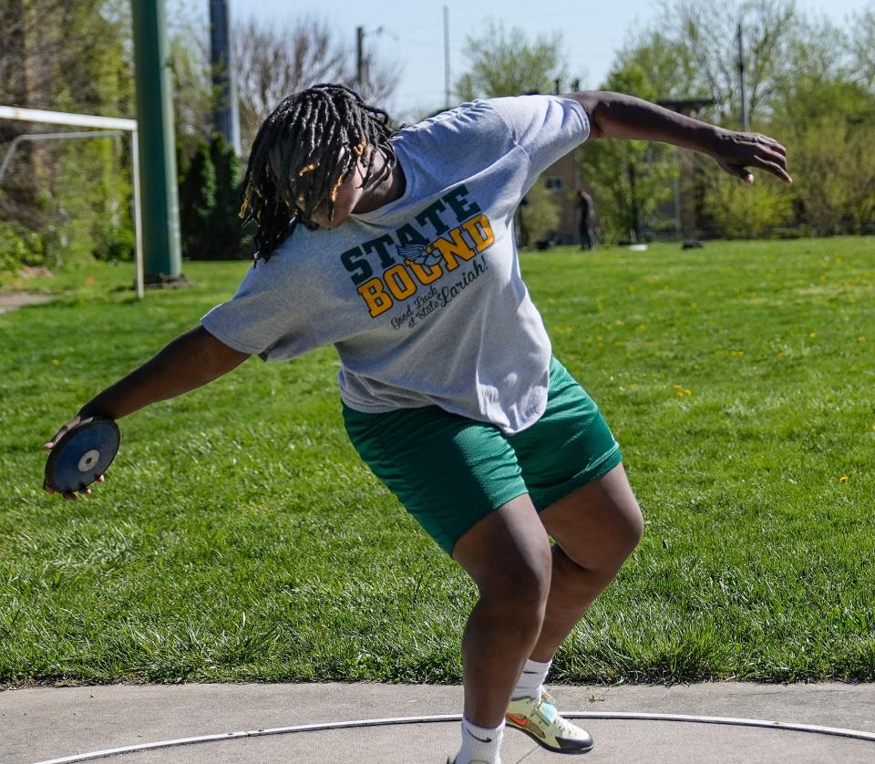 Crispus Attucks' Lariah Wooden practices throwing the discus on Tuesday, April 18, 2023.