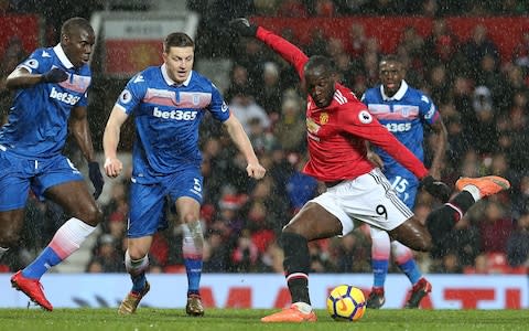 Romelu Lukaku of Manchester United scores their third goal during the Premier League match between Manchester United and Stoke City at Old Trafford on January 15, 2018 in Manchester, England.  - Credit: Matthew Peters/Man Utd via Getty Images