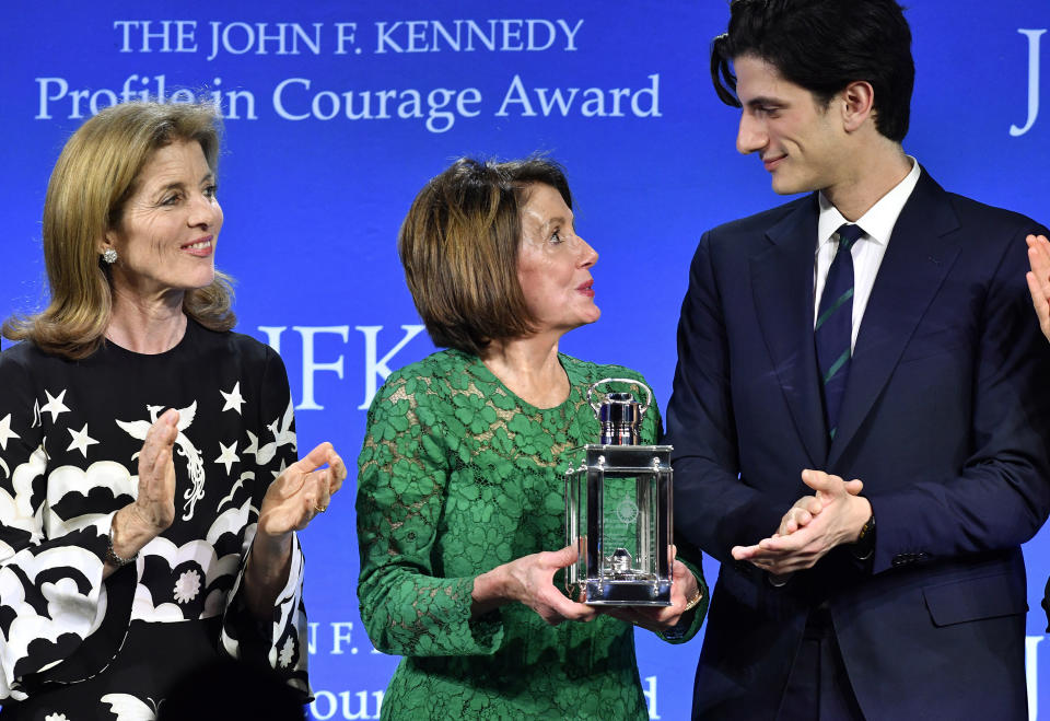 Speaker of the House Nancy Pelosi, D-Calif., center, stands with Caroline Kennedy and Jack Schlossberg as she receives the 2019 John F. Kennedy Profile in Courage Award, Sunday, May 19, 2019, at the John F. Kennedy Presidential Library and Museum in Boston. (AP Photo/Josh Reynolds)