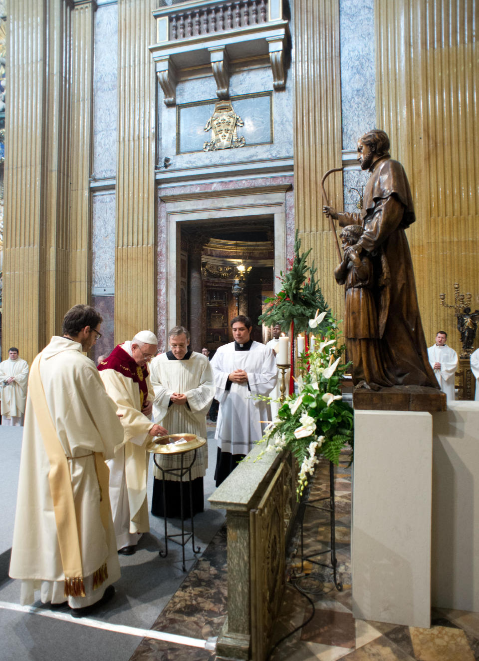 In this photo provided by the Vatican paper L'Osservatore Romano, Pope Francis celebrates a mass with the Jesuits on the occasion of the order's titular feast, in Rome's Jesus' Church, Friday, Jan. 3, 2014. (AP Photo/Osservatore Romano, ho)