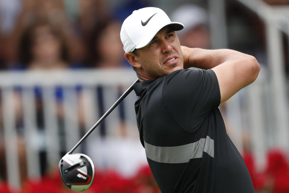 FILE - In this Aug. 25, 2019, file photo, Brooks Koepka hits from the first tee during the final round of the Tour Championship golf tournament at East Lake Golf Club in Atlanta. Koepka and Rory McIlroy are being talked about as rivals because they’ve had the best year in golf.(AP Photo/John Bazemore, File)