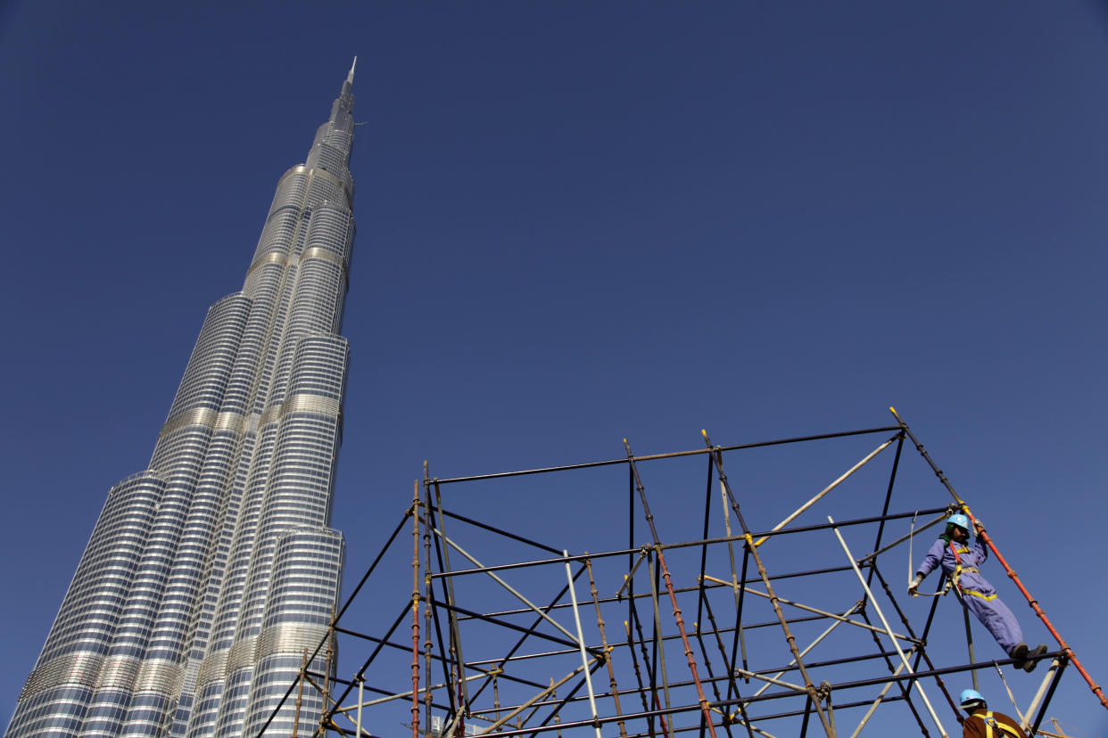 DUBAI, UNITED ARAB EMIRATES - JANUARY 01: 
Exterior shot of the Burj Khalifa tower on January 1, 2010 in Dubai, United Arab Emirates. The tower, designed by Chicago architect Adrian Smith, is the tallest free-standing structure on Earth. (Photo by Kuni Takahashi/Getty Images)