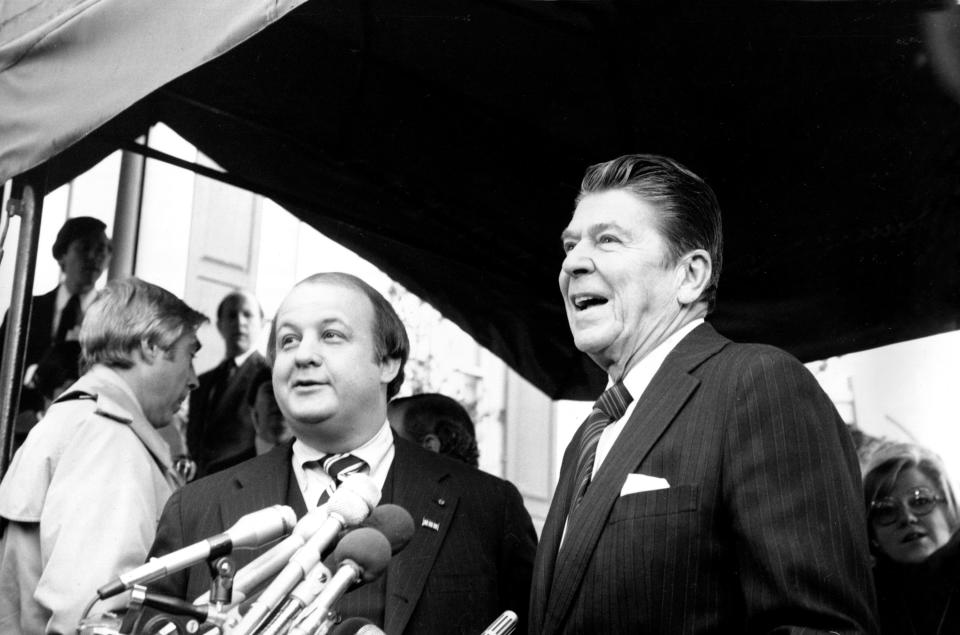 This Jan. 6, 1981 file photo shows President-elect Ronald Reagan introducing James Brady as his press secretary in Washington.