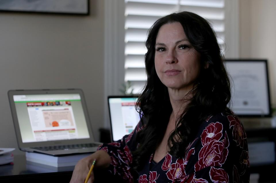 Woman sits at computer