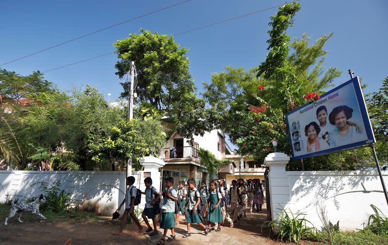Children staying in a care home set up by Karibeeran Paramesvaran and his wife Choodamani after they lost three children in the 2004 tsunami, leave the care home as they head to school in Nagapattinam district in the southern state of Tamil Nadu, India
