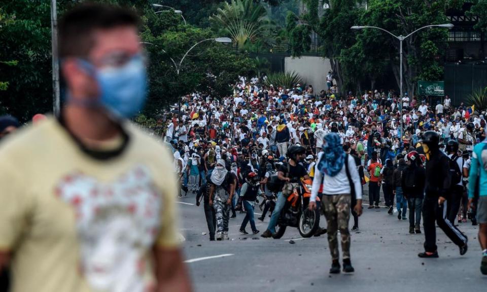 Venezuelan opposition activists demonstrate against the president in Caracas.