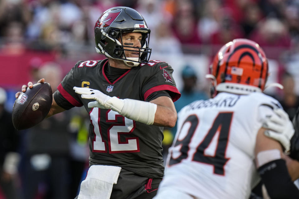 Tampa Bay Buccaneers quarterback Tom Brady (12) works in the pocket against the Cincinnati Bengals during the first half of an NFL football game, Sunday, Dec. 18, 2022, in Tampa, Fla. (AP Photo/Chris O'Meara)