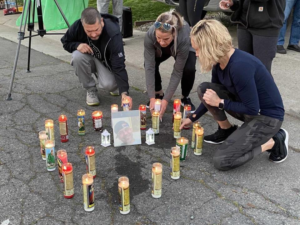 Family and friends light candles at a vigil for Christopher Gilmore, who was shot by Sacramento County sheriff’s deputies during a mental health crisis March 23 in Rio Linda.