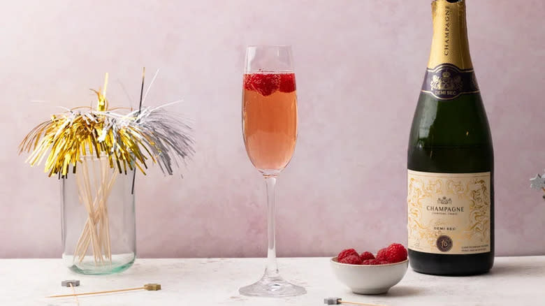 Kir Imperial drink with bottle