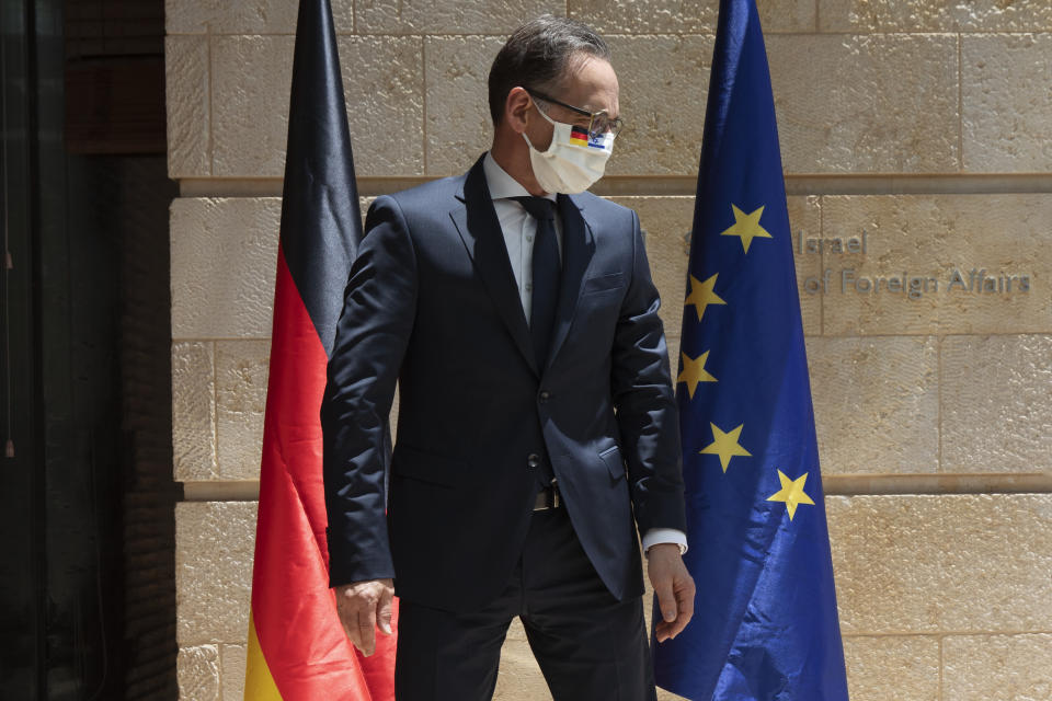 German Foreign Minister Heiko Maas, wears a protective face mask due to the coronavirus outbreak, prior to his meeting with his Israeli counterpart Gabi Ashkenazi, in Jerusalem, Wednesday, June 10, 2020. (AP Photo/Oded Balilty)